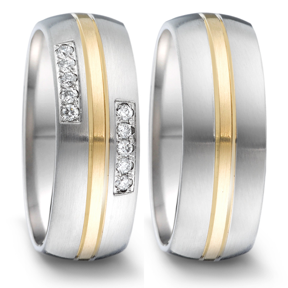 Partnerring Dieser Ring aus Edelstahl und Gelbgold ist ein elegantes und vielseitiges Schmuckstück, das mit seinem halbrunden Ringprofil und seiner markanten Breite einen hohen Tragekomfort bietet. Der Tamor Ring von TeNo ist fein mattiert und wird von einem schmalen Streifen aus edlem Gelbgold unterbrochen. Ein besonderes Highlight sind die Diamanten, die in einer hochwertigen Pavé-Fassung einen funkelnden und glamourösen Effekt erzeugen. 068.26P01.D50.XX