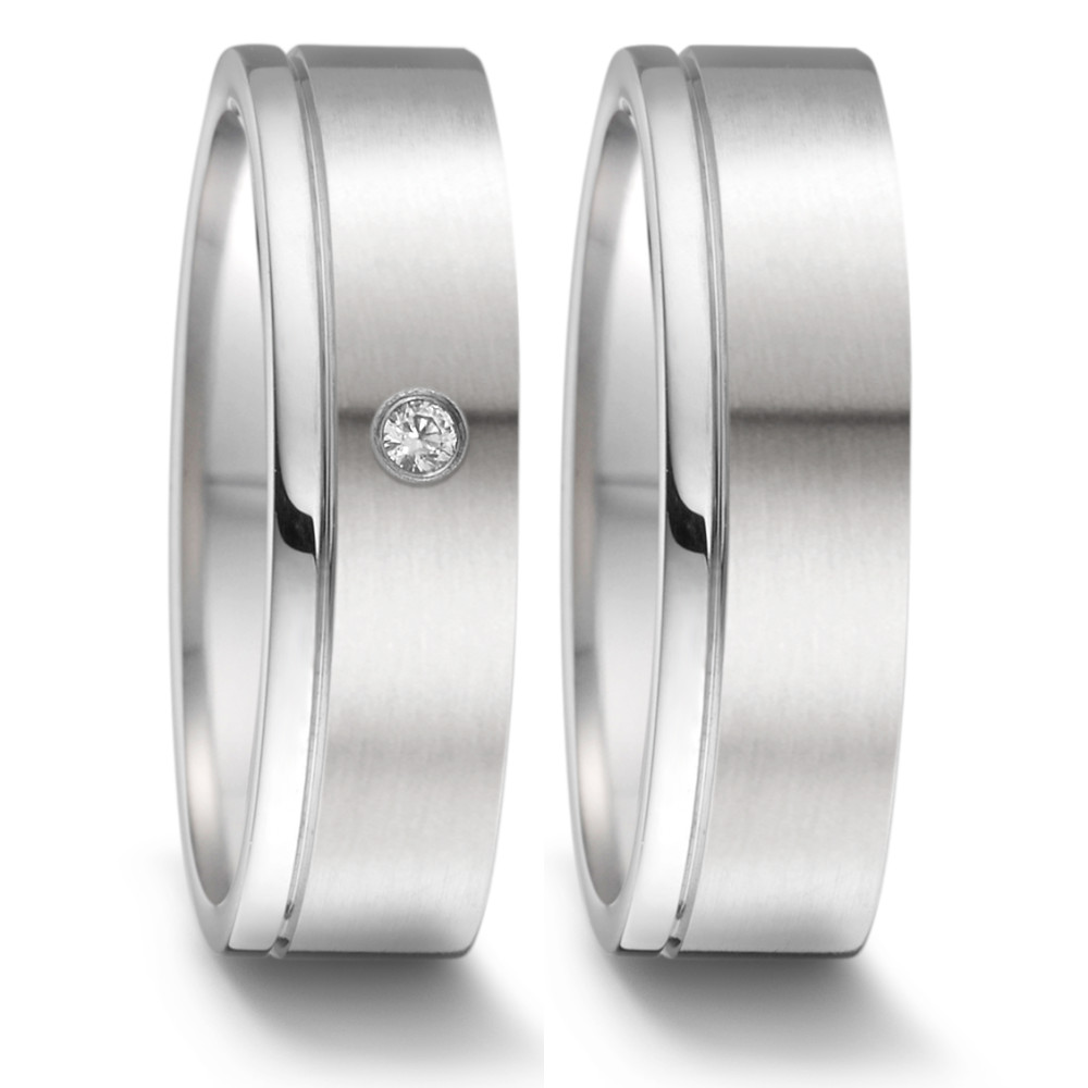 Fingerring Willkommen, meine Damen, auf der Suche nach dem perfekten Partnerring? Suchen Sie nicht weiter! Unser Partnerring aus Edelstahl mit einem Diamanten von 0,02 Karat (tw-si), hergestellt in Deutschland, ist das perfekte Accessoire für jeden besonderen Anlass. Mit seinem klassischen und zeitlosen Design können Sie sicher sein, ein besonderes Schmuckstück zu besitzen, das ein Leben lang hält. Sichern Sie sich Ihren noch heute! 069.1312.D58.XX