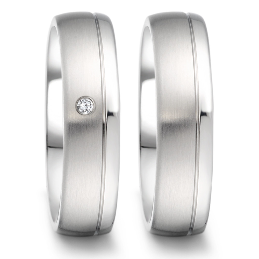 Partnerring Dieser stilvolle Damen-Partnerring von TeNo aus hochwertigem Edelstahl kombiniert eine mattierte und polierte Oberfläche für einen modernen Look. Der funkelnde Diamant ist elegant in den Ring eingefasst und verleiht ihm einen Hauch von Glamour. Dank der Comfort Fit Ringschiene, die innen gewölbt und hochglanzpoliert ist, bietet der Ring einen angenehmen Tragekomfort. Perfekt für Frauen, die zeitlose Eleganz und modernes Design zu schätzen wissen. Made in Germany, garantiert höchste Qualität und Präzision. 069.2512.D58.XX