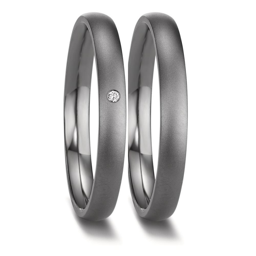 Partnerring Eleganter Damen-Partnerring aus hochwertigem 999 Tantal mit mattem Finish. Veredelt wird der Ring durch einen funkelnden Diamanten, der dezent im Ring eingelassen ist. Ein zeitloses Schmuckstück, das Liebe und Beständigkeit symbolisiert. Perfekt für besondere Momente. 52669/B06/DA1/X000