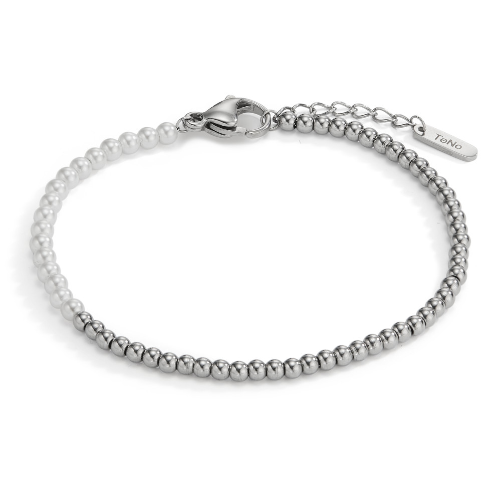 Armband Feine Kontraste mit natürlicher Note: Das Armband Miyako von TeNo kombiniert glänzende Edelstahlkügelchen mit zart schimmernden weissen Muschelperlen zu einem modernen, klaren Design. Der Karabinerverschluss mit Verlängerungskettchen sorgt für optimalen Tragekomfort und eine individuelle Passform. Ein stilvolles Accessoire - schlicht, edel und vielseitig kombinierbar.

 
