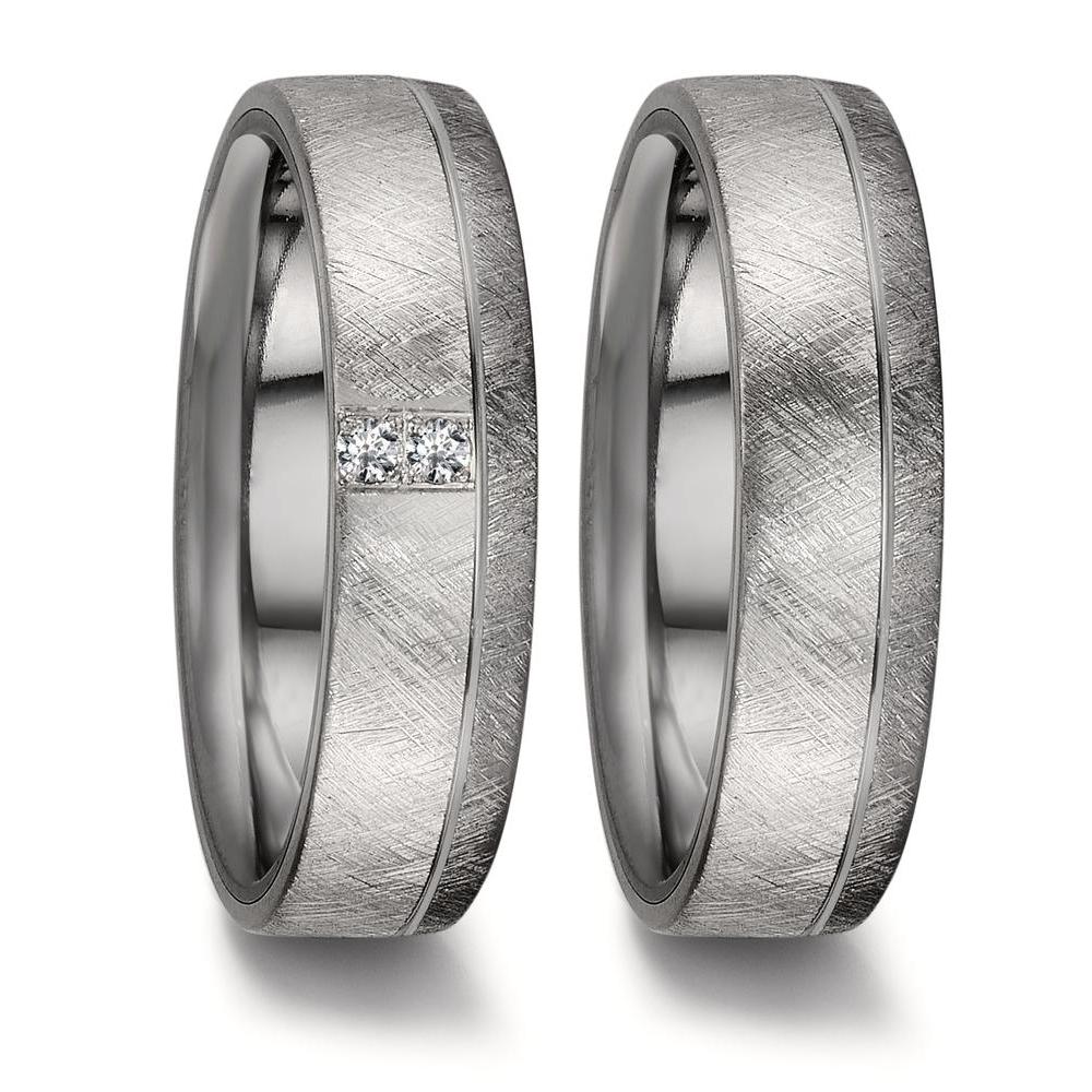 Partnerring Eleganter Damen-Partnerring aus hochwertigem 999 Tantal und 950 Platin. Die mattierte Oberfläche wird durch zwei funkelnde Diamanten perfekt ergänzt. Ein zeitloses Schmuckstück, das Stabilität und Liebe symbolisiert – ideal für besondere Momente und das gemeinsame Leben. 50010/010/004/XP02